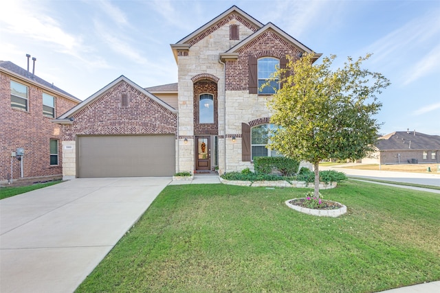 view of front property with a front lawn and a garage