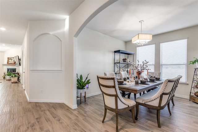 dining area featuring light wood-type flooring