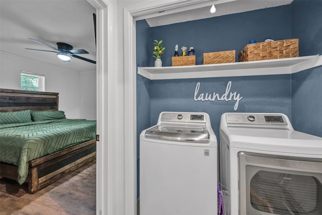 clothes washing area featuring ornamental molding, hardwood / wood-style floors, separate washer and dryer, and ceiling fan