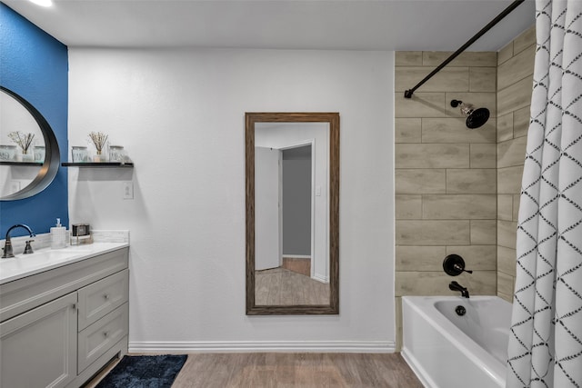 bathroom featuring vanity, hardwood / wood-style flooring, and shower / tub combo