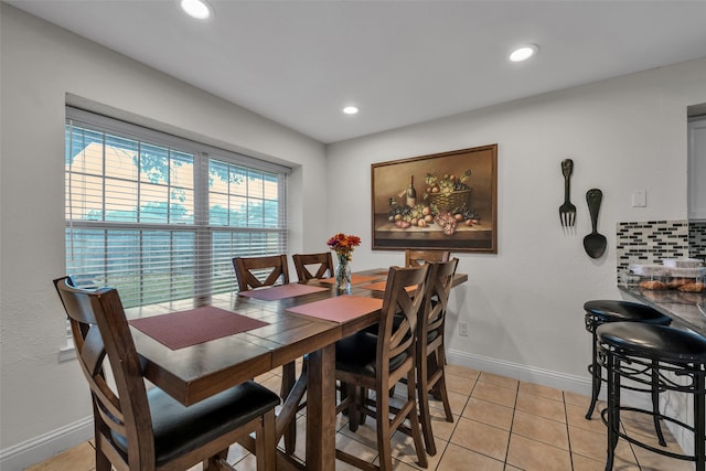 dining area featuring light tile patterned floors