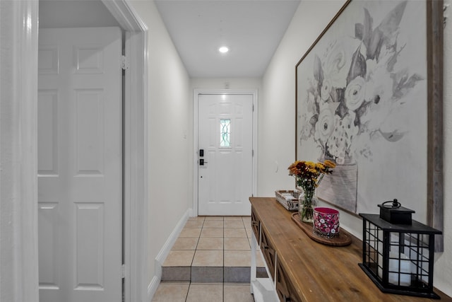 doorway to outside featuring light tile patterned floors