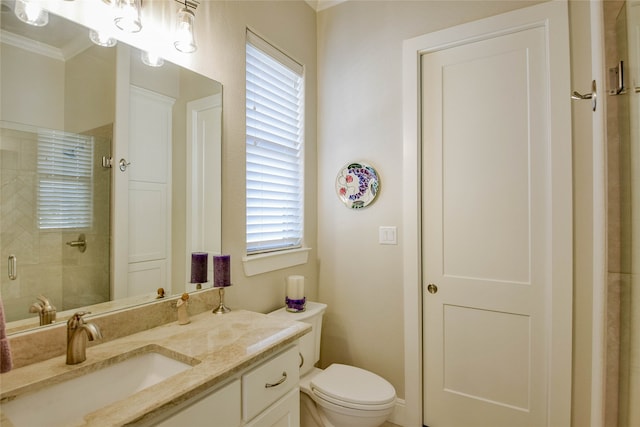 bathroom with vanity, crown molding, toilet, and an enclosed shower