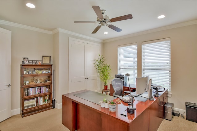 carpeted office featuring crown molding and ceiling fan