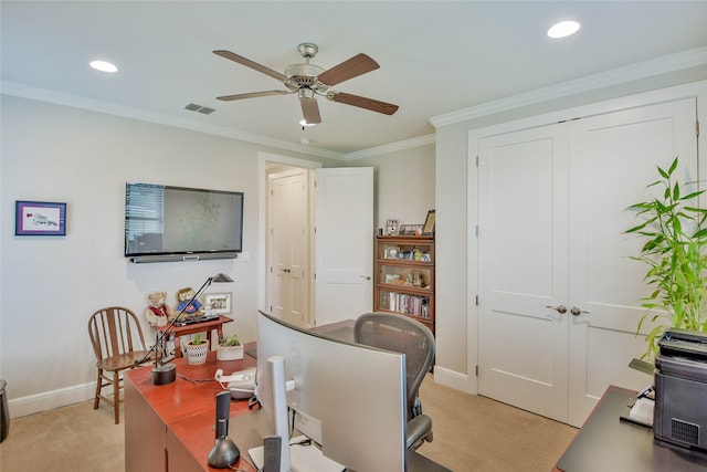 home office with ornamental molding, light carpet, and ceiling fan