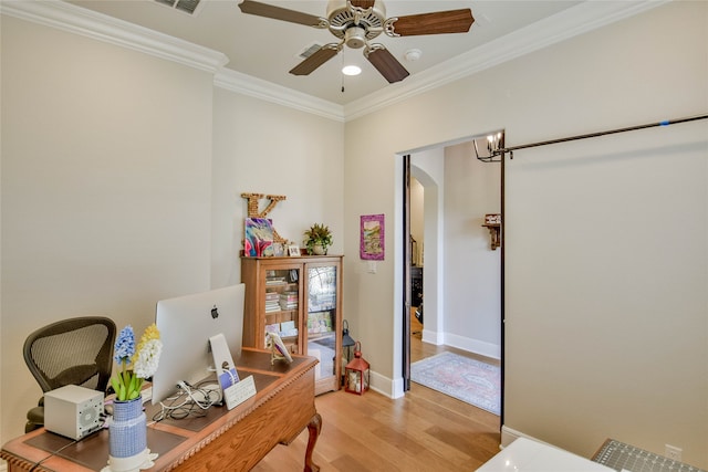 office featuring ornamental molding, hardwood / wood-style floors, and ceiling fan