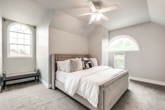 carpeted bedroom featuring vaulted ceiling and ceiling fan