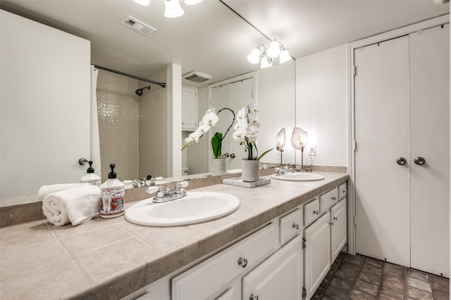 bathroom featuring vanity and walk in shower