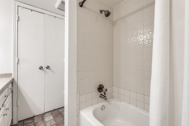 bathroom with vanity and shower / tub combo with curtain