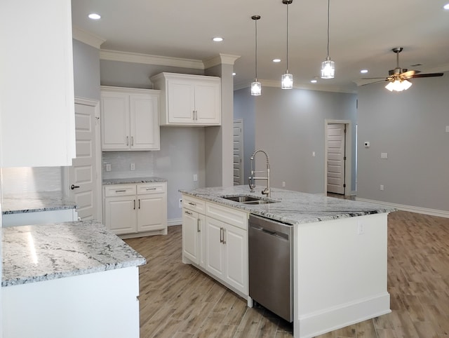 kitchen featuring a center island with sink, white cabinets, stainless steel dishwasher, and sink