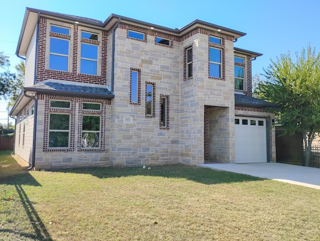 view of front of house with a garage and a front yard