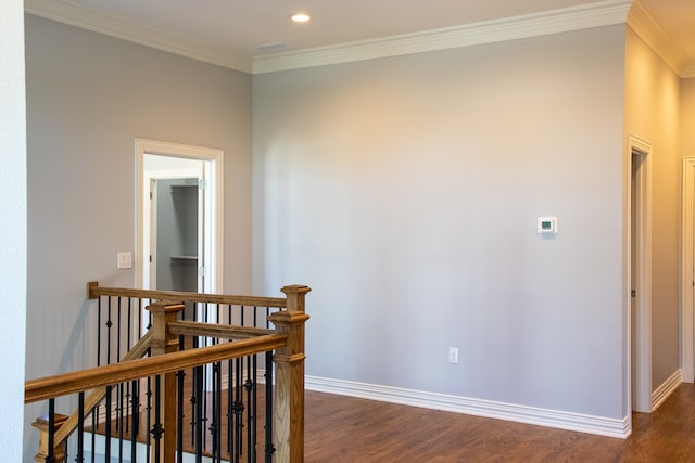 hallway featuring dark hardwood / wood-style floors and ornamental molding