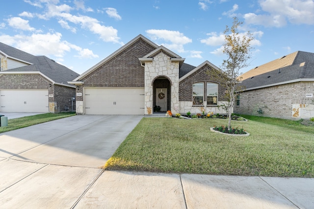 french country inspired facade featuring a front yard and a garage