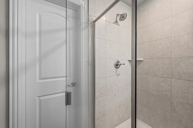 bathroom with a shower with shower door