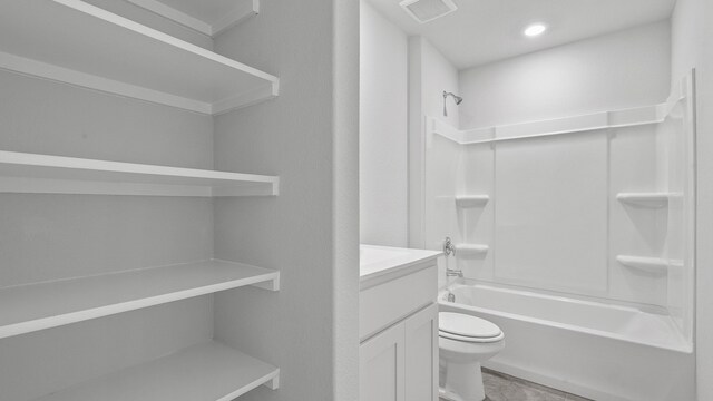 full bathroom featuring vanity, toilet, and bathing tub / shower combination