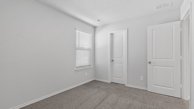 unfurnished bedroom with light carpet