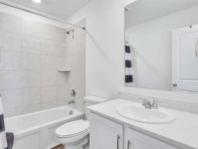 full bathroom featuring toilet, shower / bath combination, and vanity
