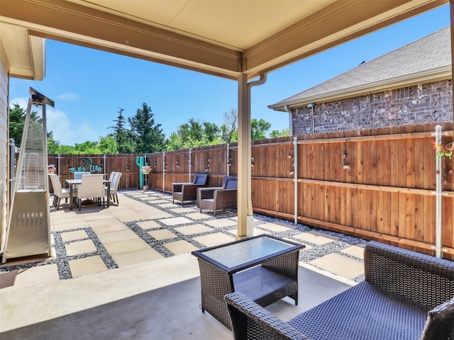 view of patio / terrace with a fenced backyard and outdoor dining space