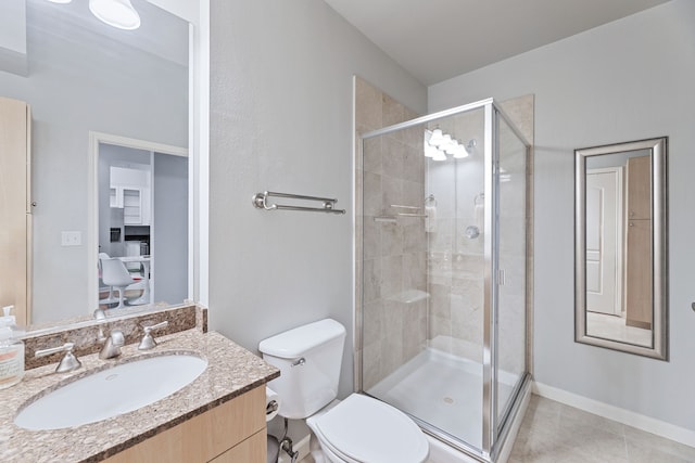 bathroom with toilet, vanity, tile patterned floors, and a shower with door