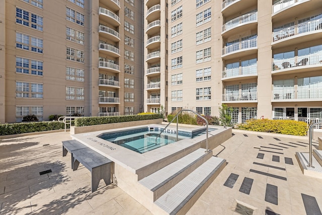 view of pool with a community hot tub