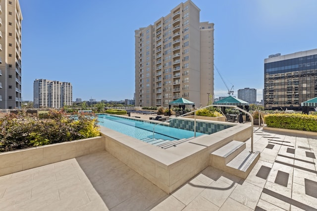 view of pool with a gazebo and a patio area