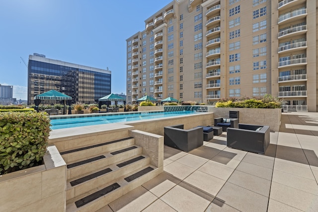 view of swimming pool featuring a patio and outdoor lounge area