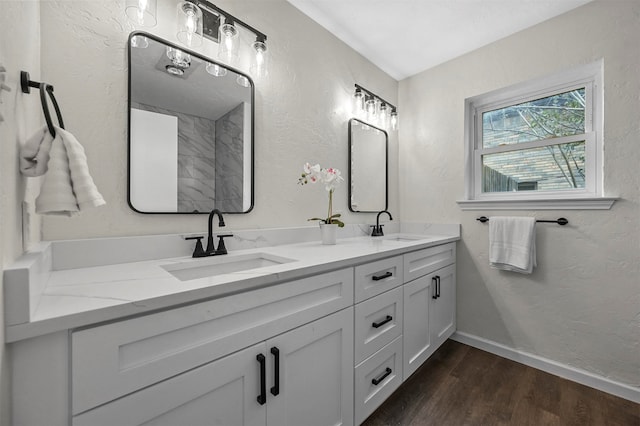 bathroom with vanity and wood-type flooring