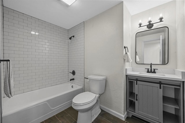 full bathroom featuring vanity, toilet, wood-type flooring, and tiled shower / bath