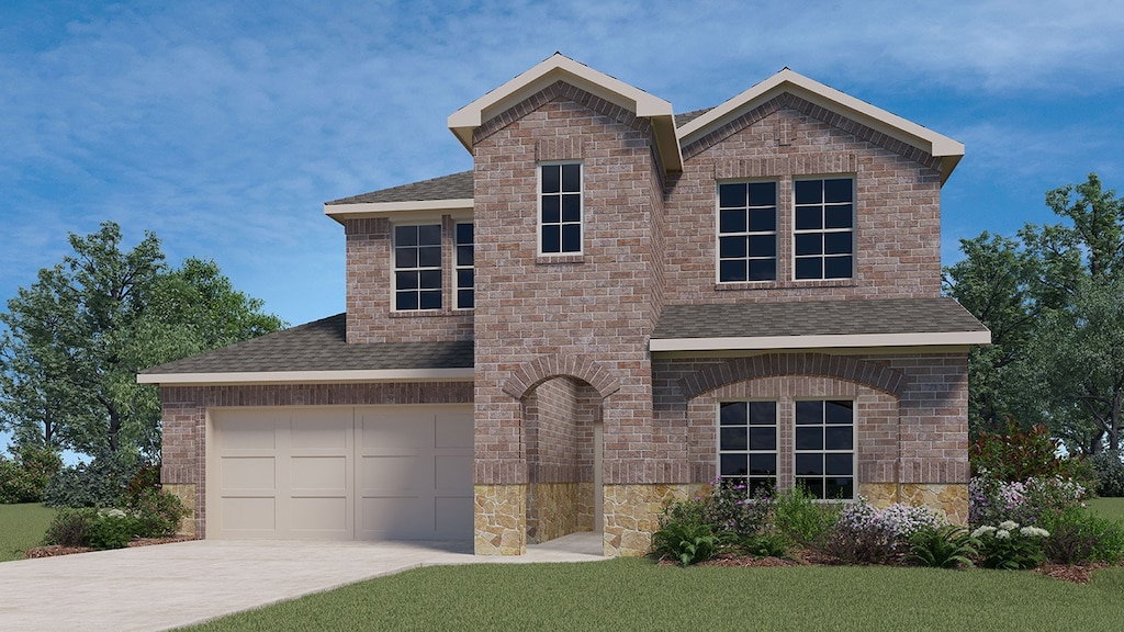 view of front of house with a front yard and a garage