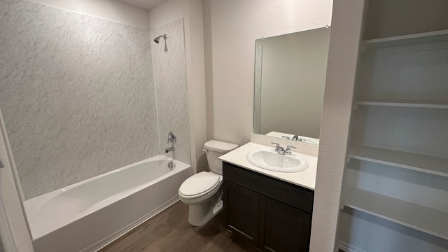 full bathroom featuring toilet, vanity,  shower combination, and wood-type flooring