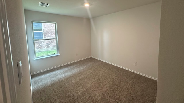 unfurnished room featuring carpet