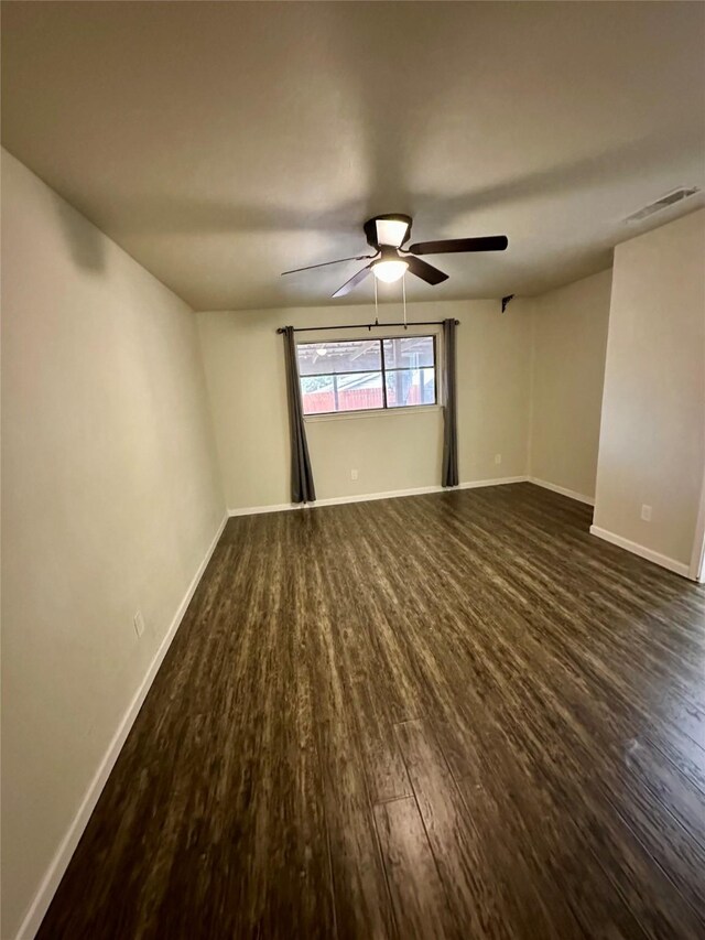 806 Mckinney Ave, Princeton, TX 75407 - empty room with baseboards, visible vents, dark wood-style floors, and ceiling fan