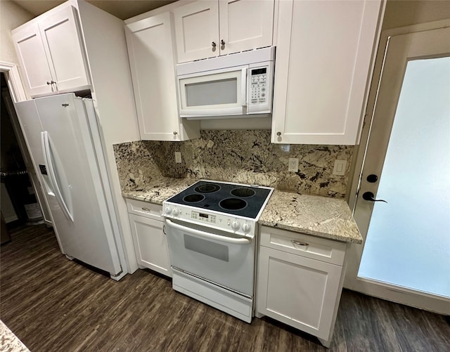 kitchen with white cabinets, dark hardwood / wood-style floors, and white appliances