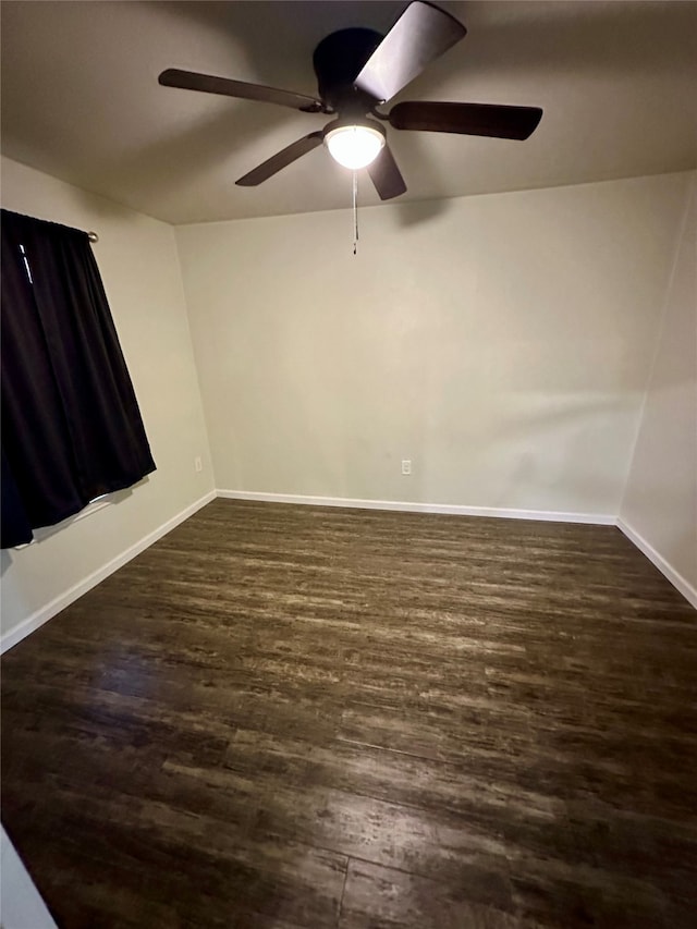 empty room featuring dark hardwood / wood-style floors and ceiling fan