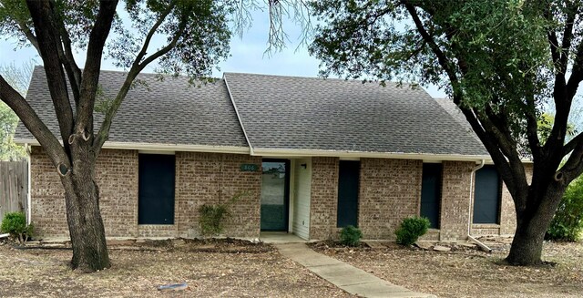 806 Mckinney Ave, Princeton, TX 75407 - view of front of home featuring brick siding and a shingled roof