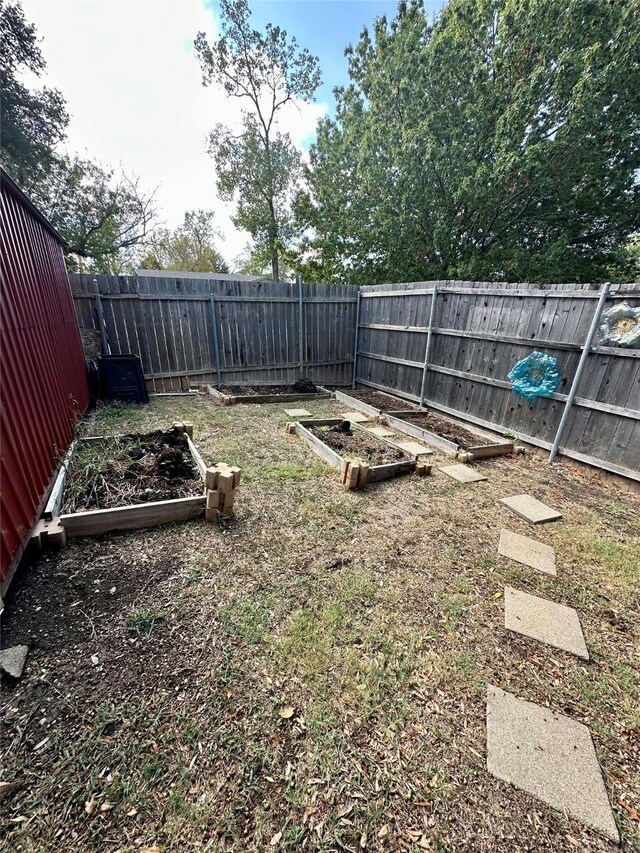 806 Mckinney Ave, Princeton, TX 75407 - view of yard with a fenced backyard and a vegetable garden