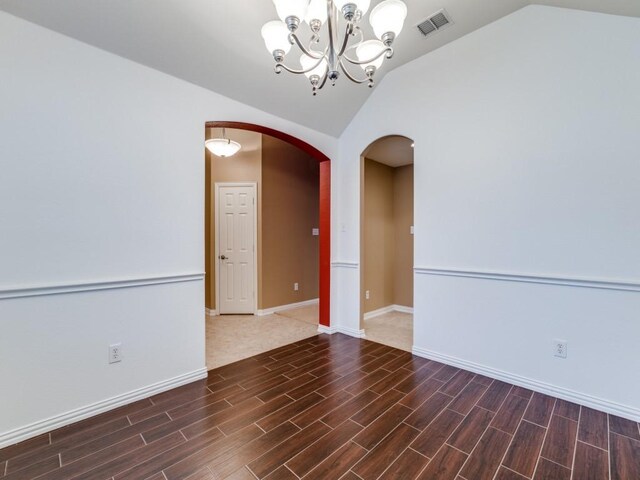 unfurnished room featuring plenty of natural light, ceiling fan, light colored carpet, and lofted ceiling