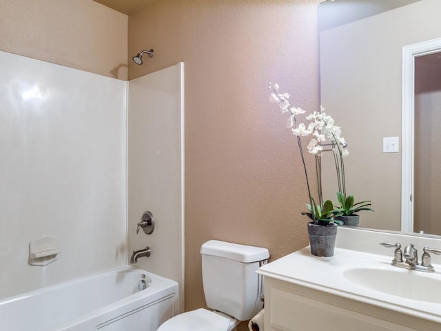 full bathroom featuring toilet, vanity, and tub / shower combination