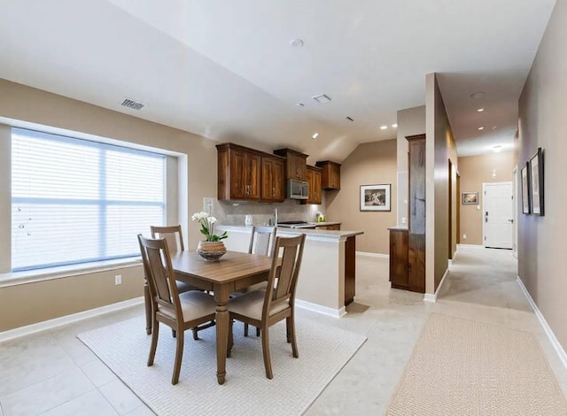 dining area featuring recessed lighting, light tile patterned floors, vaulted ceiling, baseboards, and visible vents