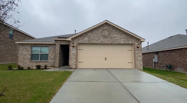 view of front of property featuring a garage and a front lawn