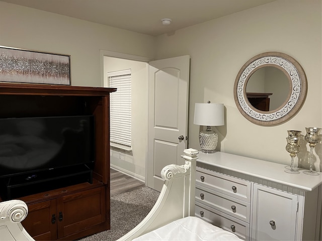 bedroom featuring dark hardwood / wood-style flooring