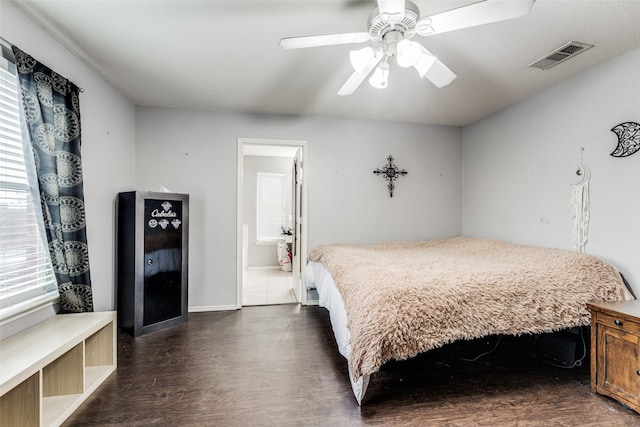 bedroom with dark wood-type flooring and ceiling fan