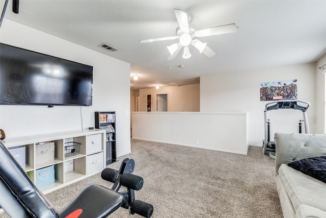 workout room featuring carpet floors and ceiling fan