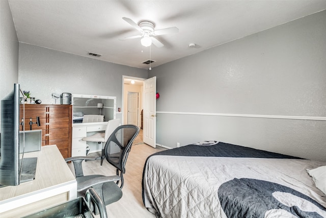 bedroom with light hardwood / wood-style flooring and ceiling fan