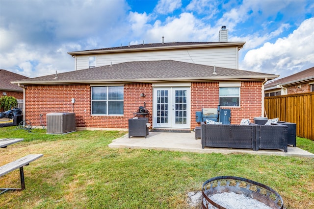 back of house featuring a patio, cooling unit, outdoor lounge area, and a lawn