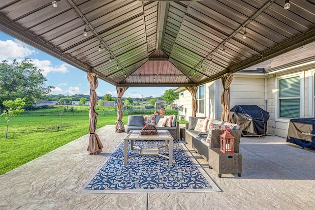 view of patio / terrace featuring a gazebo, an outdoor hangout area, and grilling area