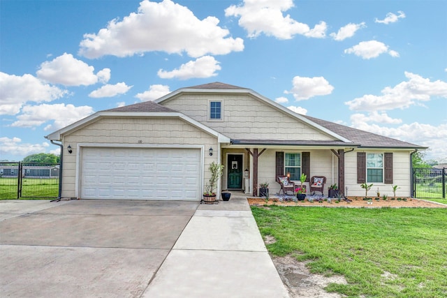 view of front facade featuring a front lawn, covered porch, and a garage