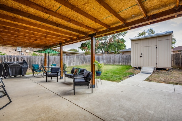 view of patio with an outdoor living space and a storage shed