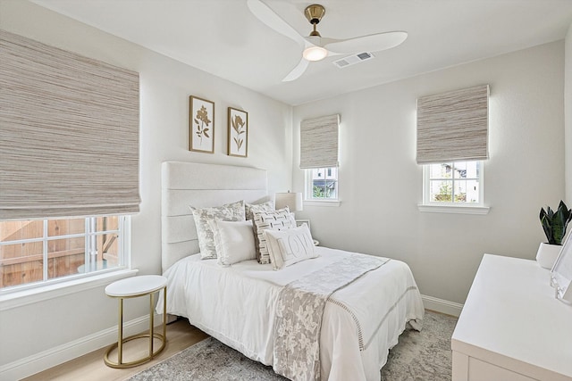 bedroom featuring hardwood / wood-style floors and ceiling fan