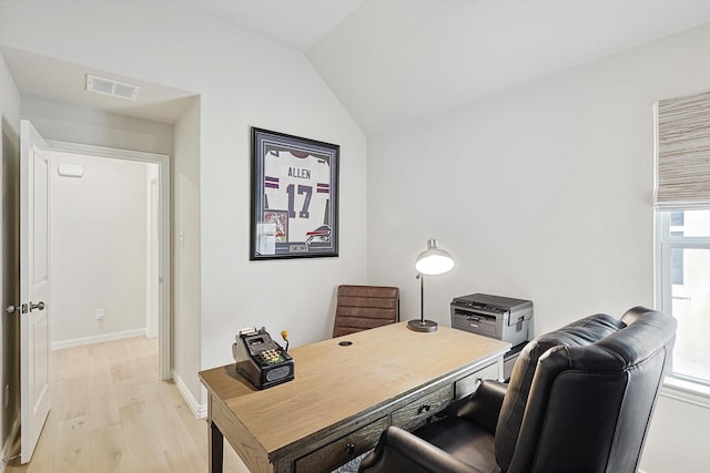 office featuring light wood-type flooring and vaulted ceiling